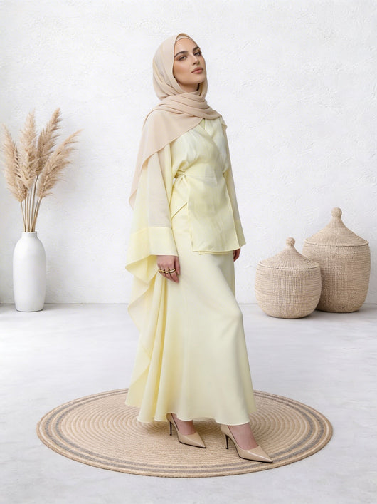 Woman in lime abaya with gentle flow and comfortable fit