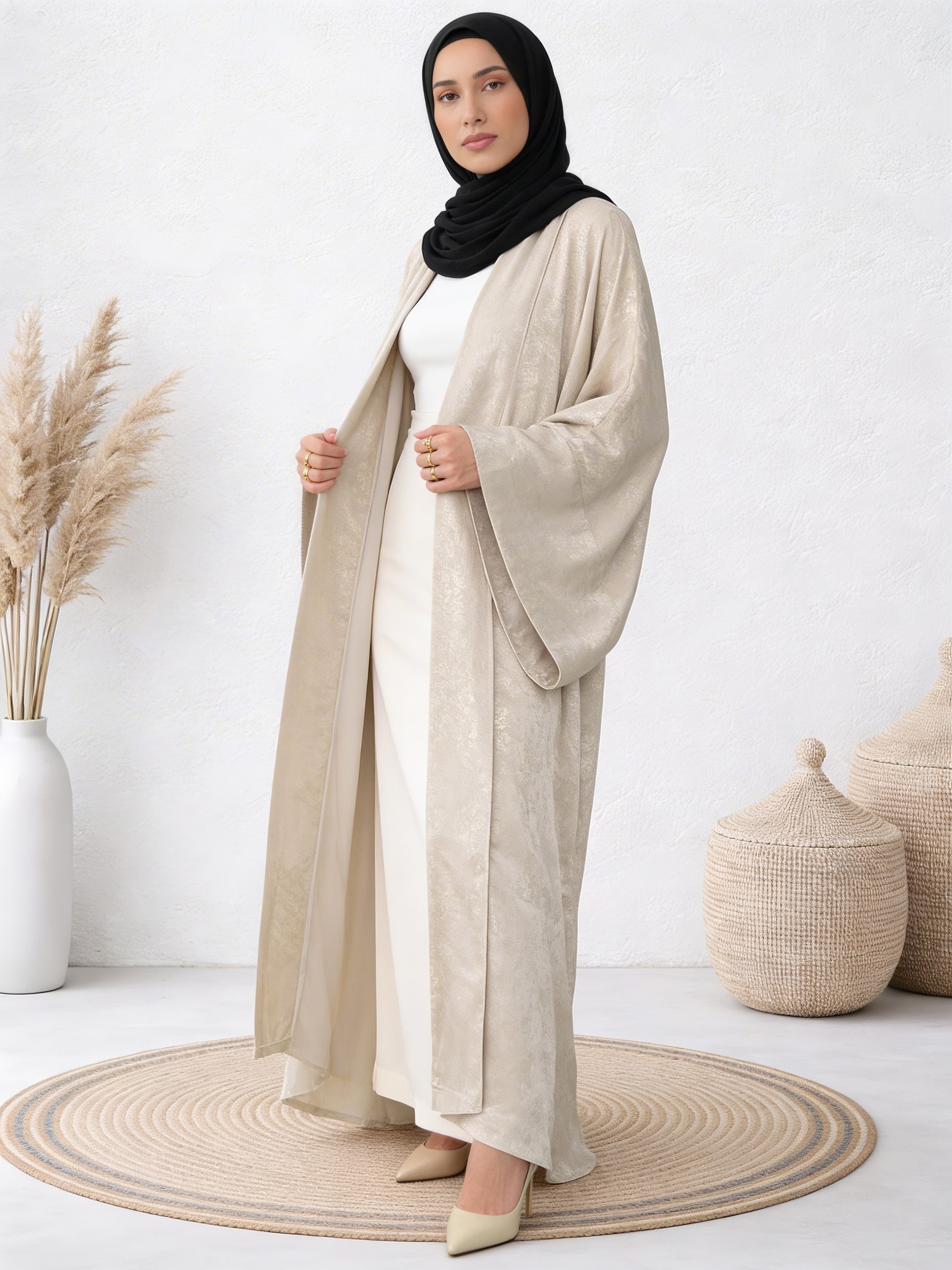 Woman wearing Safiya ayla abaya with graceful flow and refined outer layering