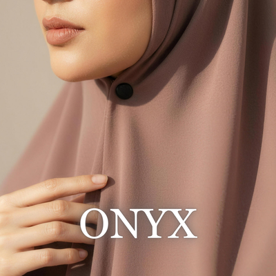 Close-up of a model wearing a soft brown hijab secured under the chin with a matte black "Onyx" magnet, with her hand resting on her chest and the text "ONYX" overlaid at the bottom.