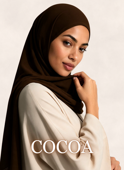 Woman wearing Nasma Instant Airy Jersey Hijab in Cocoa brown shade, side profile view, with shade name overlay