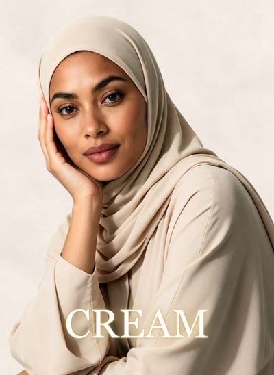Woman wearing Nasma Instant Airy Jersey Hijab in Cream shade, side profile view, with shade name overlay