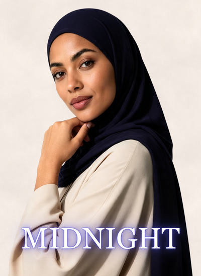 Woman wearing Nasma Instant Airy Jersey Hijab in Midnight navy shade, side profile view, with shade name overlay