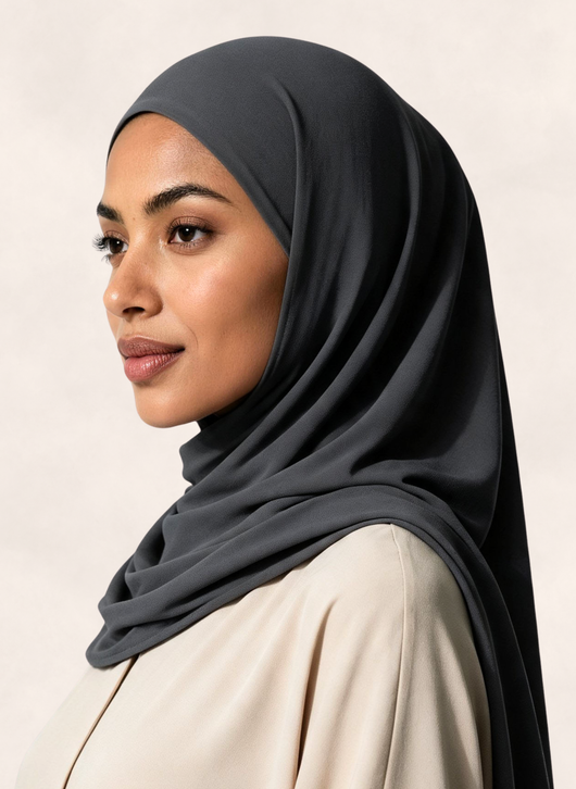 Woman wearing Nasma Instant Airy Jersey Hijab in Slate gray shade, right side angle view