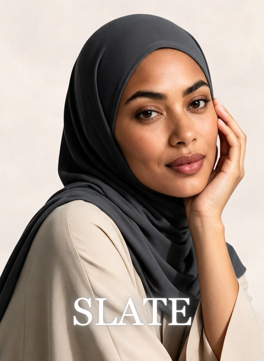 Woman wearing Nasma Instant Airy Jersey Hijab in Slate gray shade, side profile view, with shade name overlay