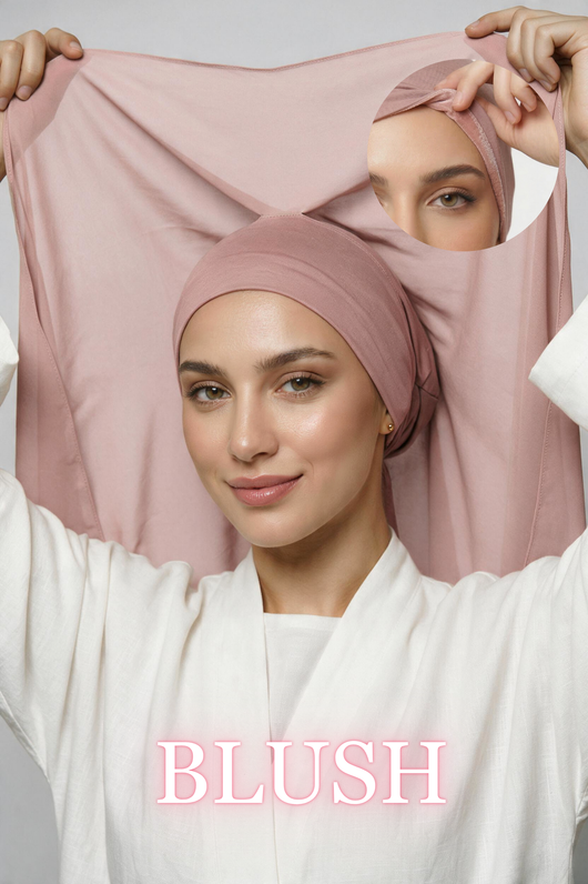 A woman wearing a blush pink instant headscarf or hijab, holding up a larger matching fabric panel behind her head. The word 'BLUSH' appears in pink text at the bottom.