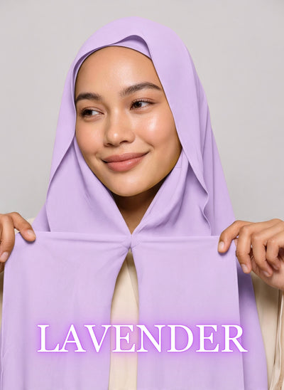 a hijabi wearing nuramira hijab in lavender purple color showcasing the built in magnets