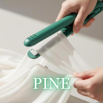Pine green NurAmira™ Hijab Straightener smoothing chiffon fabric on soft neutral background