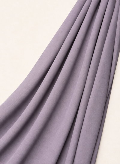 Close-up of NurAmira Instant Chiffon Hijab fabric texture in Duman lavender-gray shade, soft draped folds.