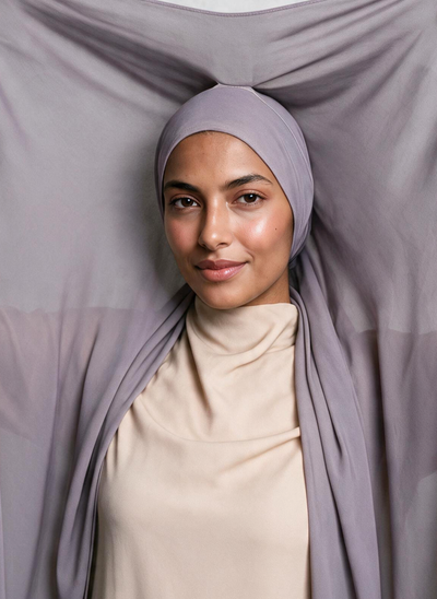 Woman wearing NurAmira Instant Chiffon Hijab in Duman lavender-gray shade, undercap style.