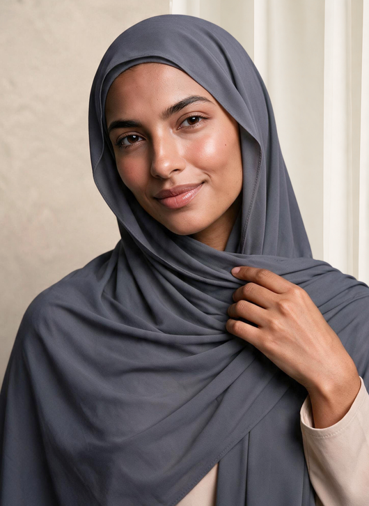Woman wearing NurAmira Instant Chiffon Hijab in Fjord slate-gray shade, draped and knotted style.