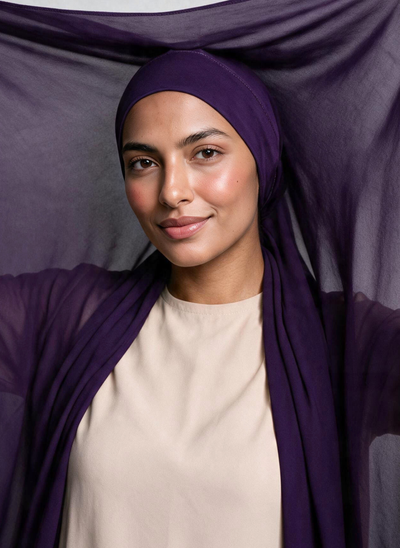 Woman wearing NurAmira Instant Chiffon Hijab in Iris deep purple shade, undercap style.