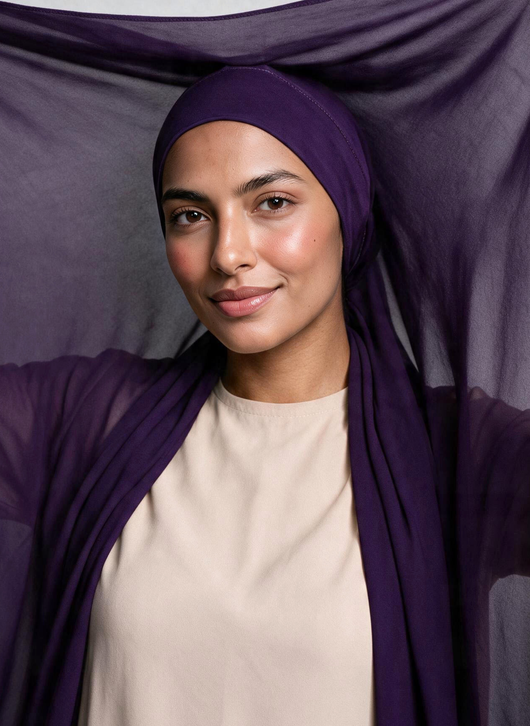 Woman wearing NurAmira Instant Chiffon Hijab in Iris deep purple shade, undercap style.