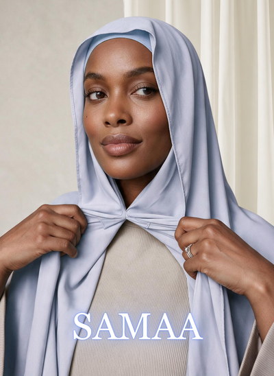 Woman wearing NurAmira™ Instant Chiffon Hijab in Samaa, holding both sides of the hijab beneath her chin.