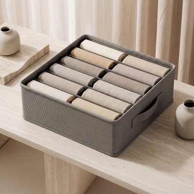 NurAmira Hijab Storage Box in Ash gray fabric, compartments filled with rolled hijabs, no text overlay.