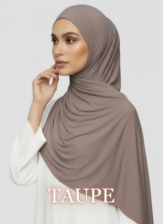 Woman wearing taupe Jersey hijab with soft flowy drape in white studio