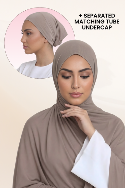 Woman wearing taupe jersey hijab with matching undercap and smooth drape in studio