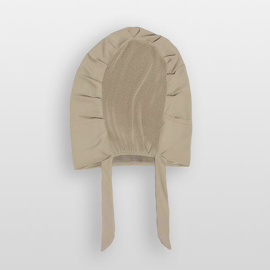 Flat lay of praline beige Amina velvet hold undercap with mesh back and adjustable tie-back in white studio