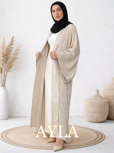 Woman wearing Safiya ayla abaya with elegant movement and relaxed layered design