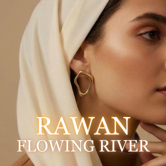Woman wearing Rawan gold earrings with soft draped hijab side profile