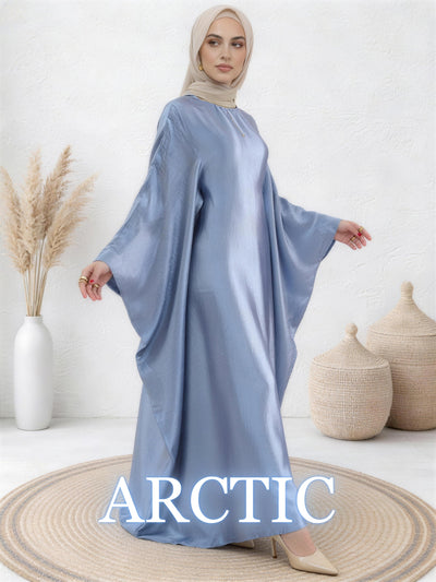 Woman wearing in arctic Yasmin abaya with soft shine and elegant movement