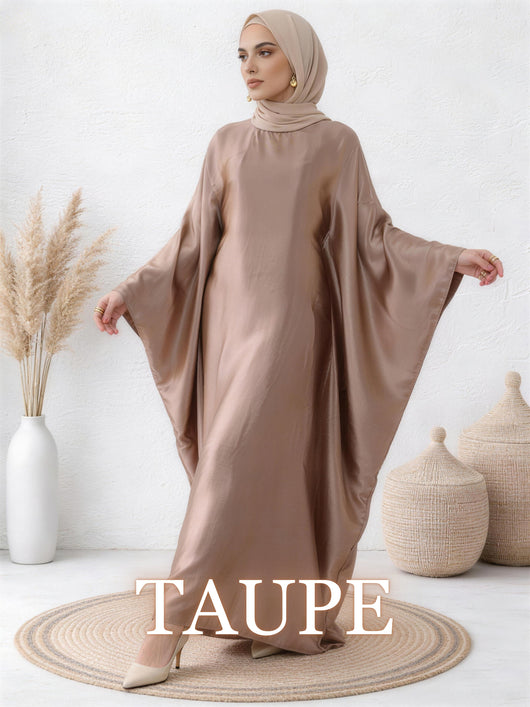 Woman wearing Yasmin abaya in taupe with understated shine and graceful flow