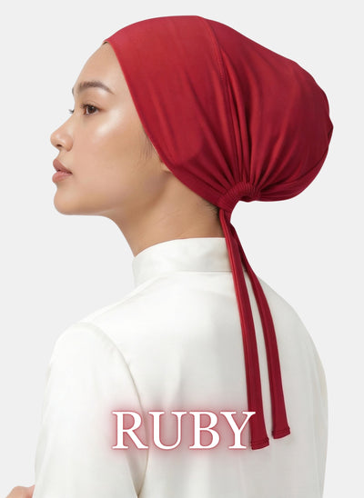 Zeenah Silk Undercap in Ruby displayed on a model with a secure tie-back fit.