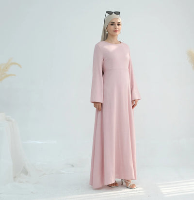 Linen abaya in pink worn from left side angle