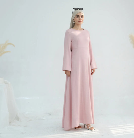 Linen abaya in pink worn from left side angle